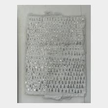  Wall sculpture in layers of plaster fabric with small pointed triangles reaching upwards