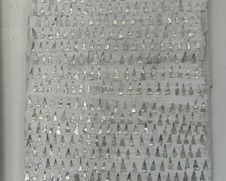  Wall sculpture in layers of plaster fabric with small pointed triangles reaching upwards